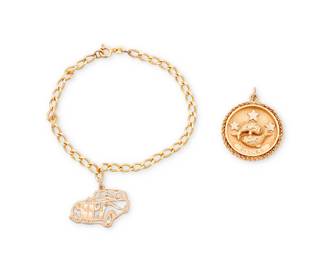 1057
A Group of Gold Jewelry
Including a 14k gold bracelet suspending a 10k gold car charm, together with a 14k gold Pisces pendant
2 pieces

Bracelet: 7 1/2 in., Charm: 1 1/8 in., Pendant: 1 3/8 in.
16.7 grams gross
Estimate: $800 - $1,200