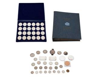 1179
A Group of Coins
Including a bound volume of 36 silver minted coins, another volume of Austrian 24 silver minted coins, plus loose bag 32 silver and copper coins and bullion
Estimate: $1,800 - $2,200