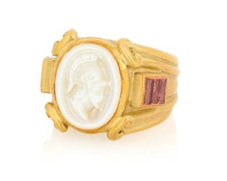 1010
Joan Boyce: An 18K Gold, Mother-of-Pearl and Pink Tourmaline Ring
Featuring carved mother-of-pearl soldier cameo, accented by six baguette pink tourmalines, signed JBL

Size: 6
18.5 grams gross
Estimate: $800 - $1,200