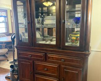 BEAUTIFUL ASHLEY LEXIMORE BUFFET SERVER WITH HUTCH. DARK BROWN FINISH WITH STACKED MOULDING. FELT LINED DRAWERS.