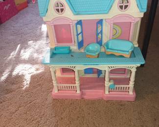 Barbie Dream House!   Not big enough for all these Barbies, they moved.