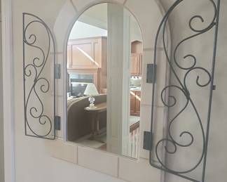 Arched Faux Stone Mirror with Wrought Iron Shutters