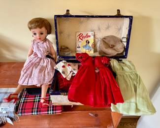 1950's Miss Revlon Doll in mint condition - with assortment of clothing and wardrobe trunk.