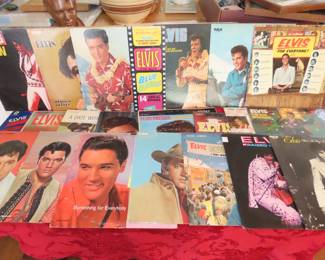 Large collection of Elvis LPs, 8 track cassettes, books, magazines, trading cards, memorabilia items.