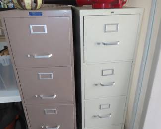 Two four drawer metal file cabinets.