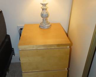 One of two nightstands and two table lamps.