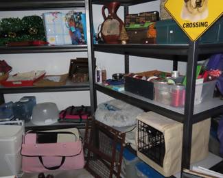 Shelves of pet supplies and equipment, carriers, stroller, bed, etc. Board games, paper goods supplies, ribbons and gift bags.