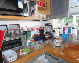 Kitchen items, Pyrex, toaster oven, Vitamix.  Brand new roasting pan. Kuerig coffee machine, George Foreman grill.