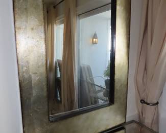 Gold framed mirror.