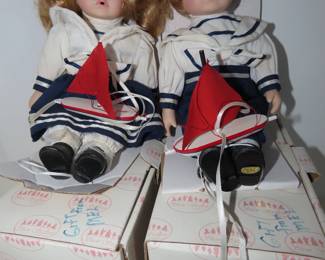 Sailor boy and girl dolls.