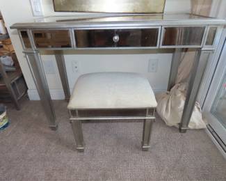 Mirrored dressing table and padded stool.