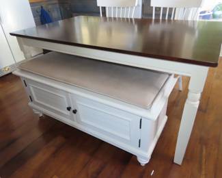 Dining table, two chairs and a storage bench seat.