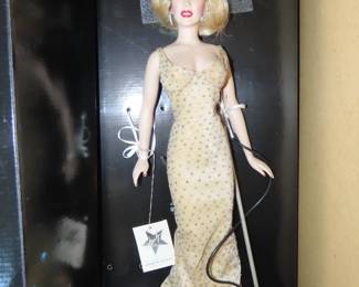 Boxed Marilyn Monroe doll.