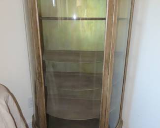 Bow front curio cabinet.