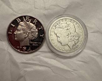 $10 silver Liberty coin and silver dollar
