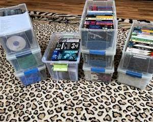 Lot 107  Vintage Movie and TV Show VHS Tapes Collection in Storage Boxes