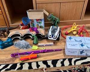 Lot 112  Mixed Toy Lot with Vehicles, Dinosaurs, and Game Sets