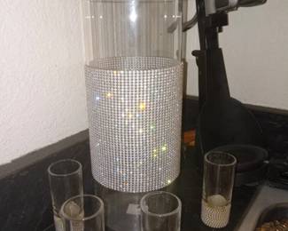 Glass vase with shot glasses