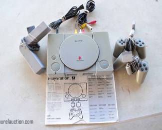 Playstation Console with Paddles and Accessory 