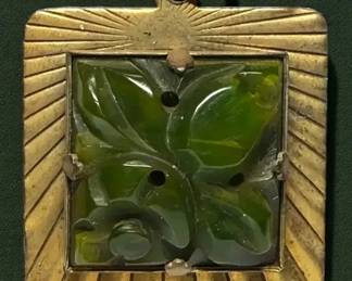 Carved, pierced, green Bakelite pendant