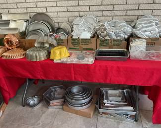 large collection of cake pans