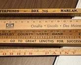 Advertising wooden yardsticks. https://modestlambestatesales.hibid.com/