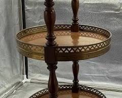 Oval 3 tier occasional table. https://modestlambestatesales.hibid.com/