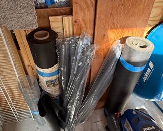 Assorted Construction and Landscaping Materials including Roofing Felt, Pipe, Wire Mesh, Lumber, Plywood, Wheelbarrow, and Lawnmower