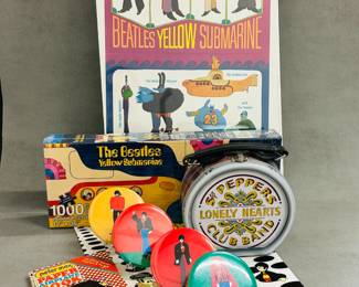 More The Beatles Yellow Submarine and Sgt Peppers Lonely Hearts Club Band memorabilia, and a Peter Max Paper Airplane book