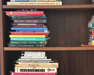 Reference books for collectors including Metal Toys & Automata, The Ultimate Doll Book, Paper Toys of the World, Penny Toys, Collecting Tin Toys, The Story of American Toys, Cartoon Collectibles, American Antique Toys 1830-1900, and The Victorian Household Album.