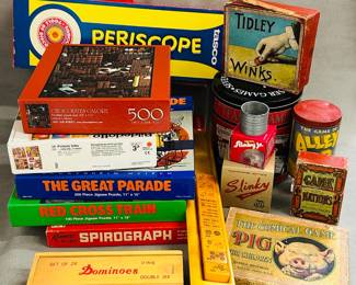Vintage toys and games including jig saw puzzles, dominoes, Tasco Periscope, Tiddly Winks, Slinky, Slinky Jr., Game of Nations, and more