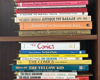 Reference books including A Guide to Metal Toys, Precious Paper Dolls, Jewelry of Southeast Asia, Collecting Toy Soldiers, Superhero Comics of the Golden Age, The Yellow Kid, World Encyclopedia of Cartoons, and more