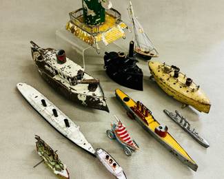 A collection of vintage tin and diecast metal toy boats