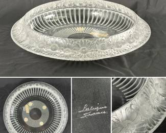 A Lalique "Marguerites" crystal bowl (a beautifully decorative centerpiece!)  The bowl features a crown of frosted daisies in relief around the rim with ribbed sides and is signed "Lalique France" on the base. Approximately 14 inches in width.