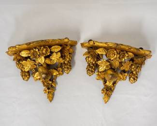 A pair of vintage giltwood rose and fruit wall brackets/shelves