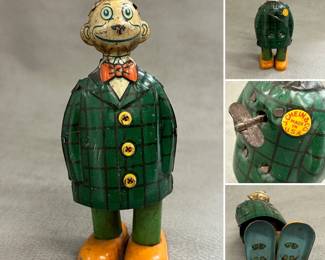 A vintage J. Chein & Co. Happy Hooligan tin wind-up toy, made in U.S.A.
