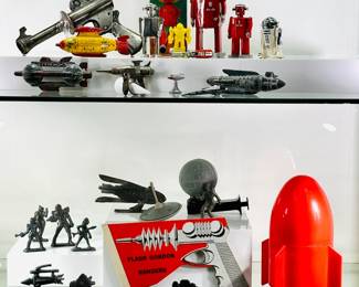 A collection of vintage and reproduction tin robots and space toys, including the Atomic Robot Man, R2D2, "ray guns," vintage Flash Gordon Rangers cardboard ray gun, vintage Buck Rogers cast metal figurines
