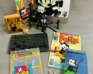 Vintage Felix The Cat toys and collectibles including an antique Felix the Cat Nifty tin wind-up toy, circa 1920s, text on the toy reads "FELIX" and "Copyright 1922, 1924 By Pat Sullivan Made in Germany"; four Felix the Cat dice, a "Cartoon Favorites" VHS tape featuring four classic Felix the Cat cartoons, a Felix The Cat 1930's Pat Sullivan Pencil Box Box, a Harvey Classics Felix the Cat comic book, issue #5, titled "The Nine Lives of Felix the Cat!" and a book Felix: The Twisted Tale of the World's Most Famous Cat by John Canemaker