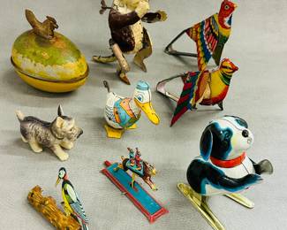 Collection of vintage tin lithograph wind-up toys, some manufactured by J. Chein & Co. or Louis Marx & Co. or Meier, and includes includes various animal and character figures, such as a duck, a dog, birds, rabbits, and a clown.