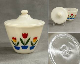 A vintage Anchor Hocking Fire-King milk glass covered bowl with a lid, often referred to as a grease jar, in the "Tulip" pattern; approximately 6" tall.
