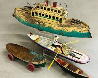 A collection of vintage tin and diecast metal toy boats
