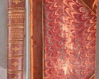 A view of volume VIII of six volumes of Thackeray's Works (William Makepeace Thackeray) published in 1877, London. Hardcovers, half leather and marbled paper, includes volumes IV, VII, VIII, IX, X, XII. Publishers Smith, Elder, & Co., London.
