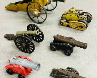A selection of vintage toy cannons and a toy tank, some are pressed tin and diecast metal; includes a German made 1950's GAMA T56 wind up tank toy, a Playmobil Accessories Pirate Red Base Gray Canon, and a vintage miniature Civil War replica toy cannon