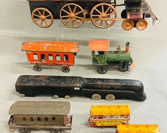 An antique 1890's Dayton tin Hill Climber friction trolley/locomotive train toy, a vintage 1946 era metal Stafford Liner train engine with original paint, a pair of vintage Schylling miniature tin trolley car Christmas ornaments