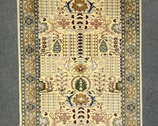 A lovely Oushak area rug with a traditional Persian design and an ivory background, 49" x 71".