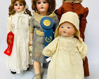 A 22-inch Heubach Koppelsdorf 250 bisque head doll in blue and gold dress, carrying a sachet bag and wearing a blue 1st place ribbon; more dolls by Heubach Koppelsdorf, JD Kestner, Moriumura Brothers, Max Handwerck, Simon & Halbig, UNIS France, Armand Marseille and others available at this sale!