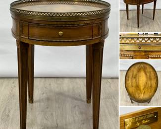 A vintage Baker Furniture "Collector's Edition" French Bouillotte-style oval side&nbsp;table with galleried top and book-matched veneer