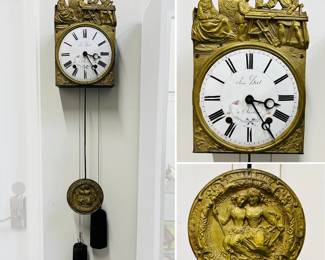 An antique French Comtoise or Morbier clock with repoussé gilt brass figural scenes and an enamel dial signed by the clockmaker "Jean Birt à Saulieu"