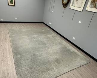 A 9’ x 12’ Odegard handmade carpet in a fine checkerboard pattern.