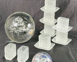 Six Barolac Josef Inwald art glass frosted daisy toothpick or match holders with matching trays, and two without trays; a large clear glass encased bubbles paperweight, and a vintage studio art glass paperweight with a colorful swirl or "scramble" design. 
